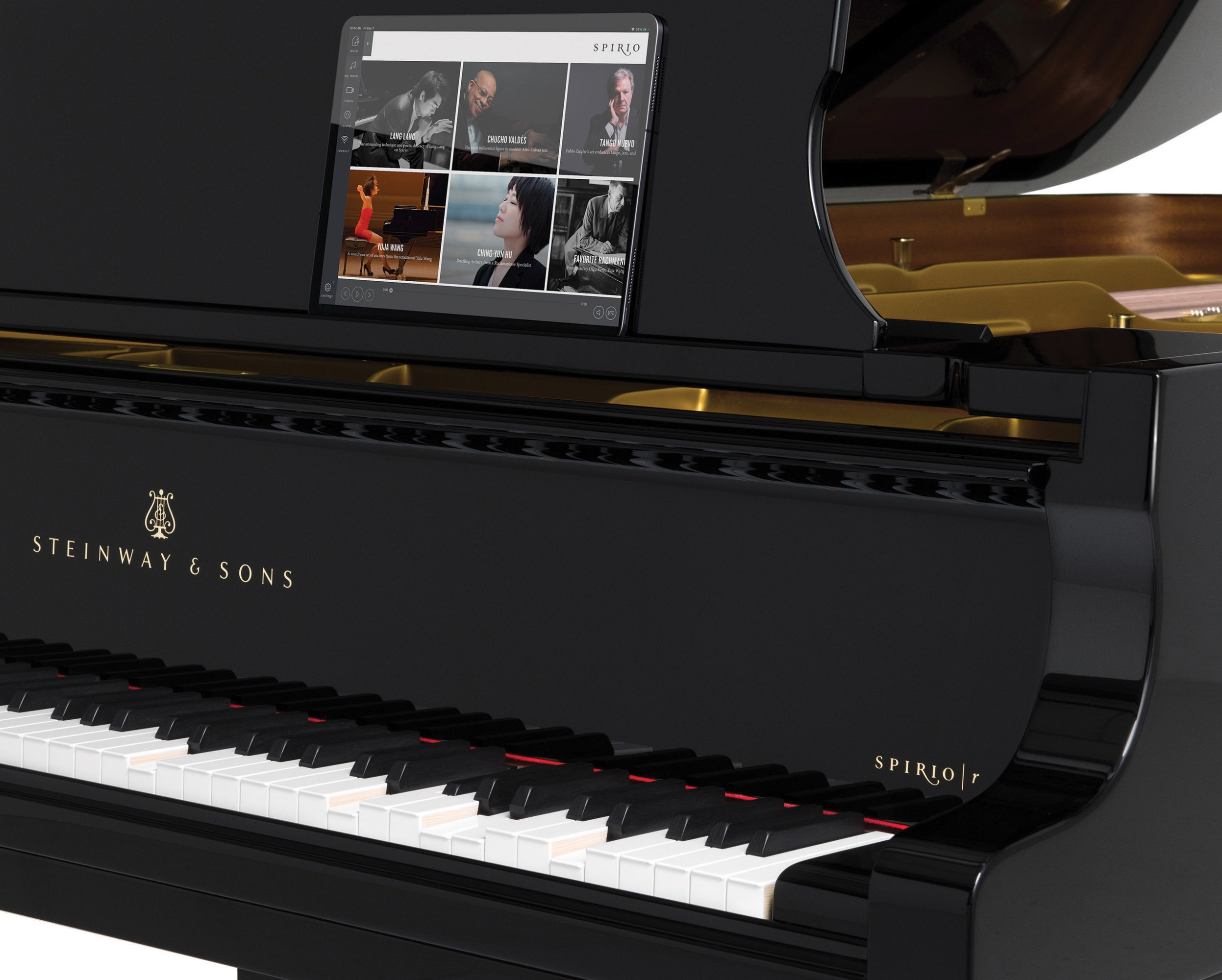 a Steinway piano with a tablet resting on the sheet music stand, showing a screen from the Spirio app with 6 options for songs
