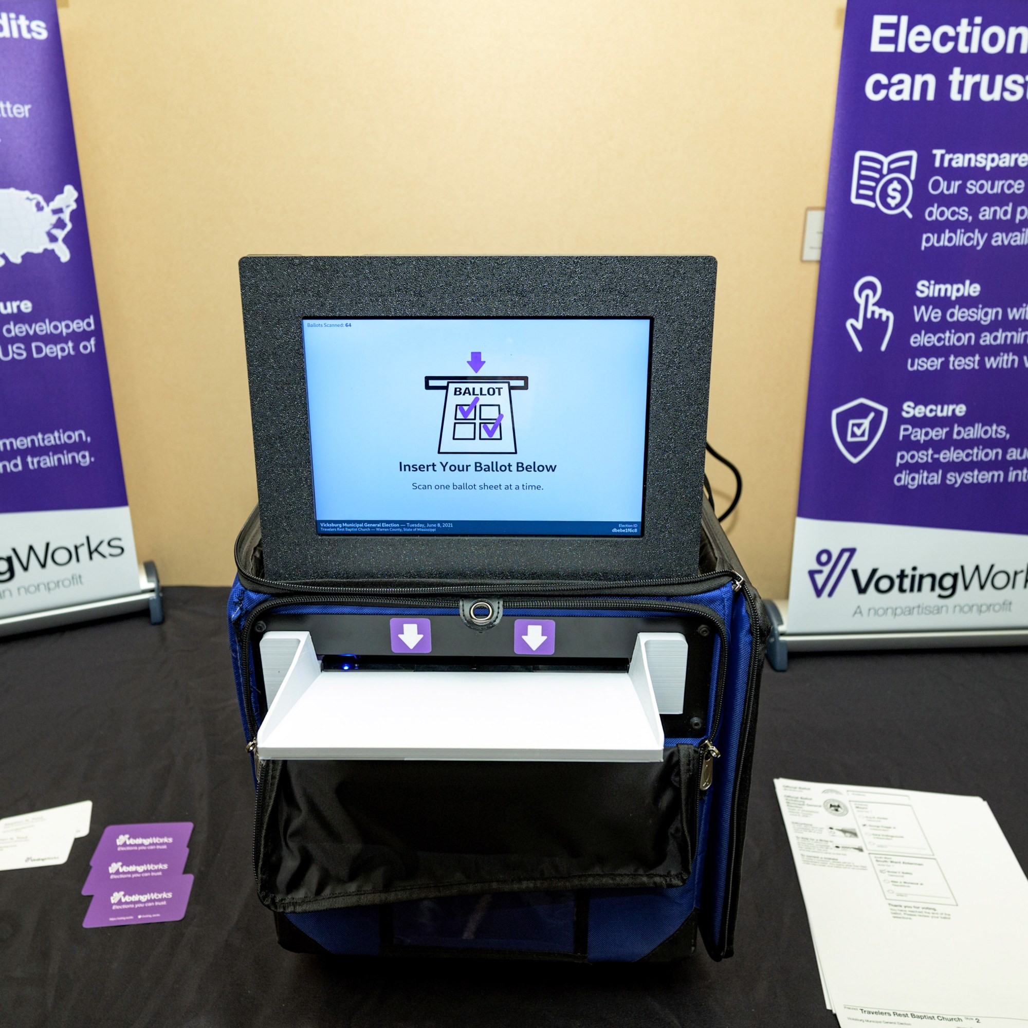 a VotingWorks display of at the National Association of Secretaries of State in 2022 showing a voting screen built into a tamper-evident ballot box
