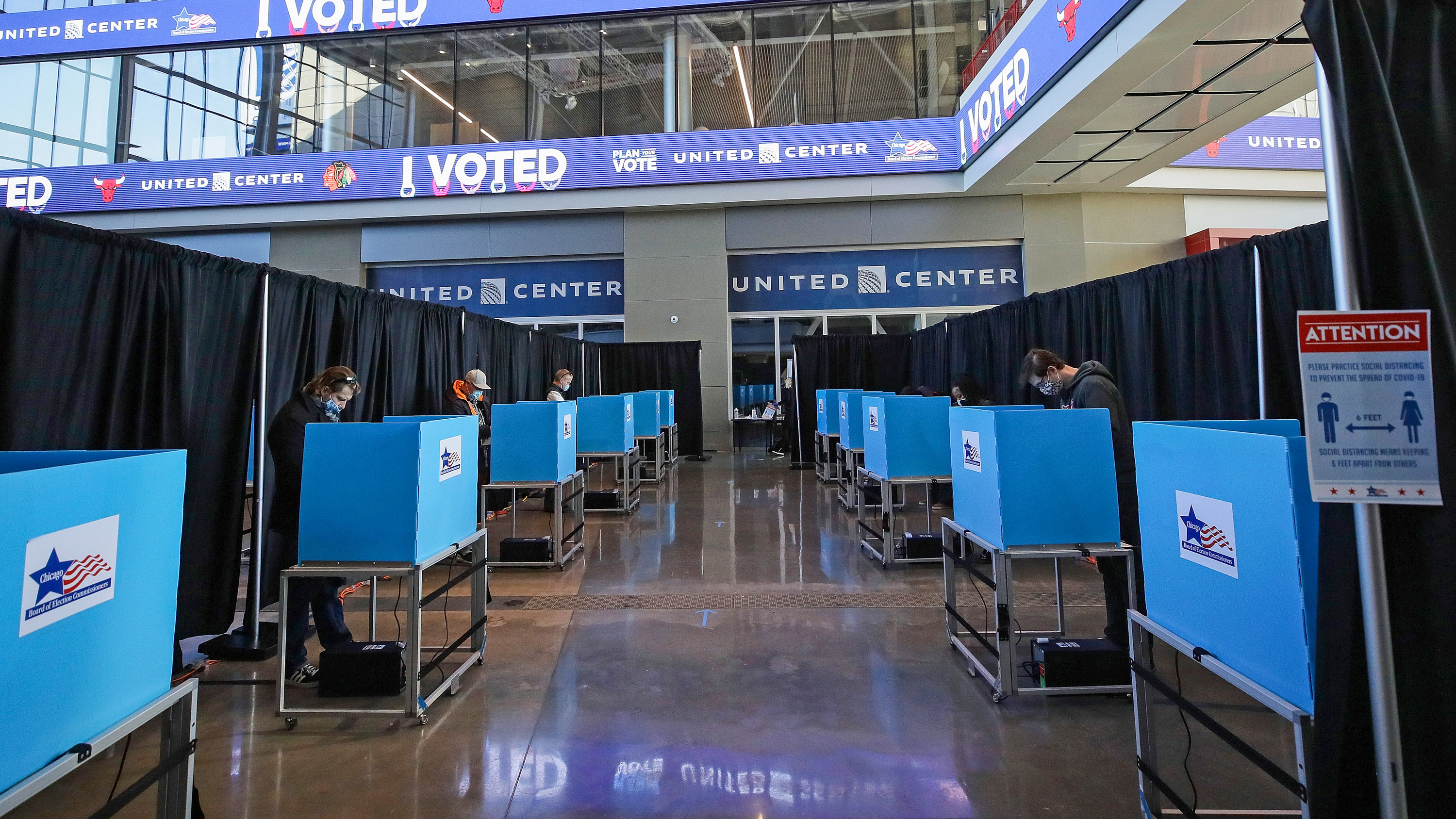 voters casting ballots at the United Center in Chicago in 2020