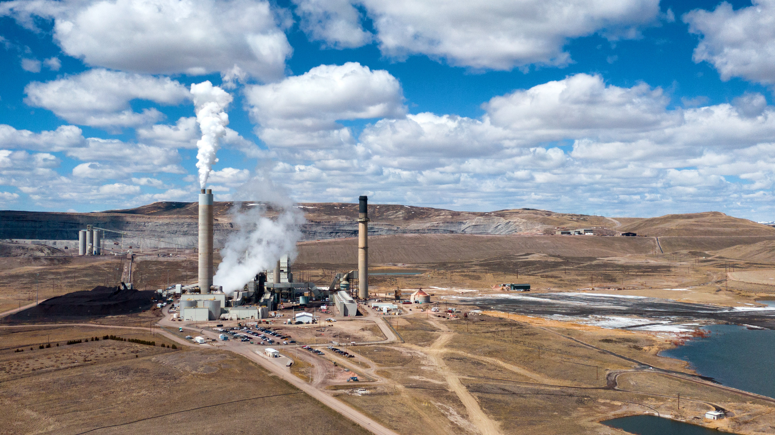 wide shot of coal plant in a brown landscape