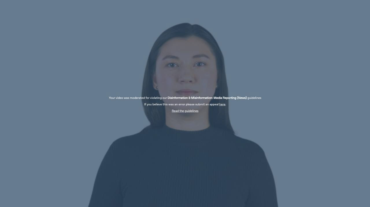 screencap from Synthesia video with text overlay "Your video was moderated for violating our Disinformation & Misinformation: Media Reporting (News) guidelines. If you believe this was an error please submit an appeal here."