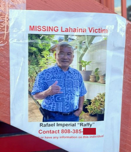 Poster taped to wall that reads,"MISSING Lahaina Victim. Rafael Imperial 'Raffy'" with the contact number redacted