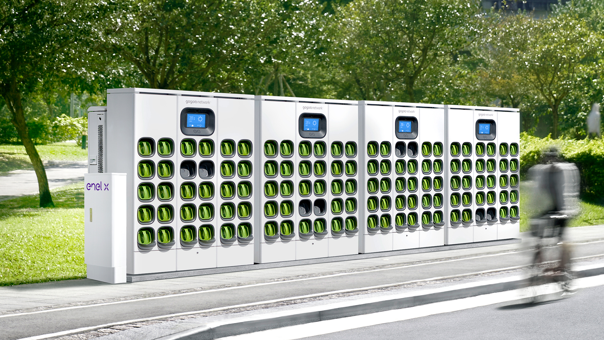 On the side of a road stands a gogoro power station with an enel x system box on the side. Each of the four network station units holds 30 batteries.